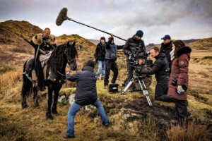 On location Beddgelert, Snowdonia with actor on horse, Bad Wolf production