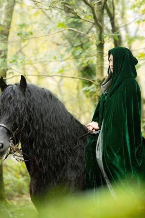 Amie Laws on Odysseus (Friesian stallion) for a photoshoot by Llyn Padarn (Llanberis Lake)